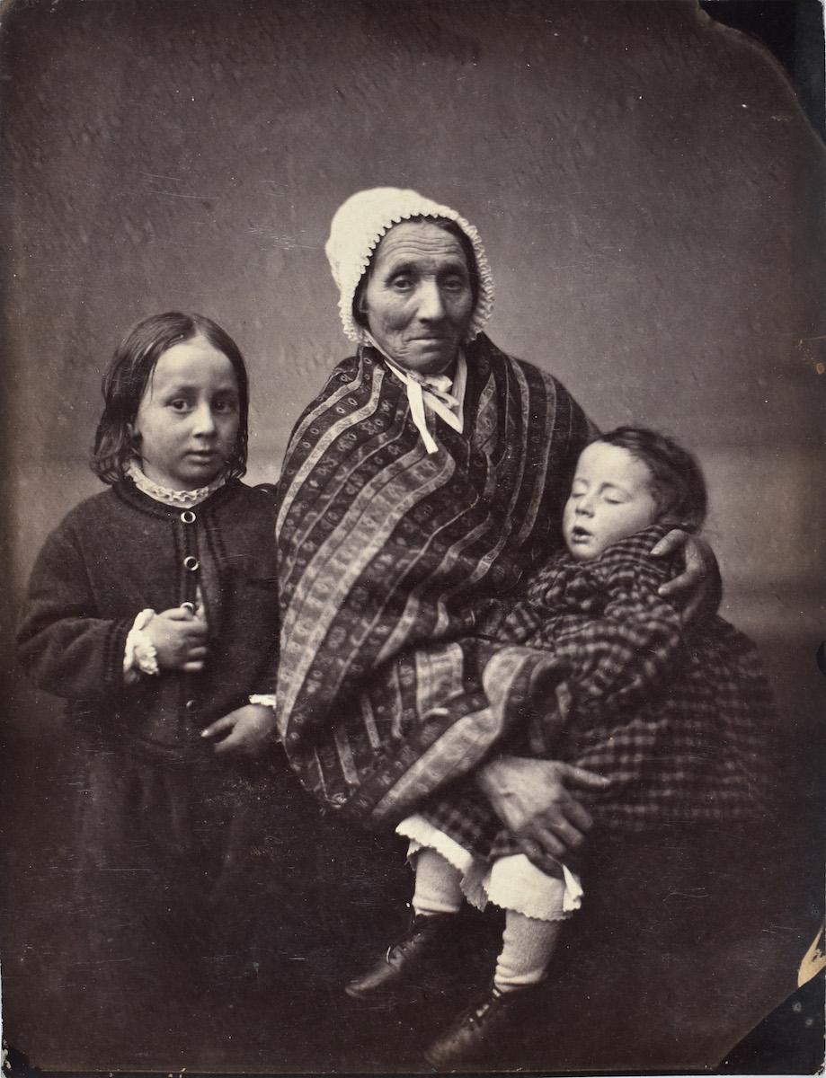 Old Woman with Two Children in Winter Garb