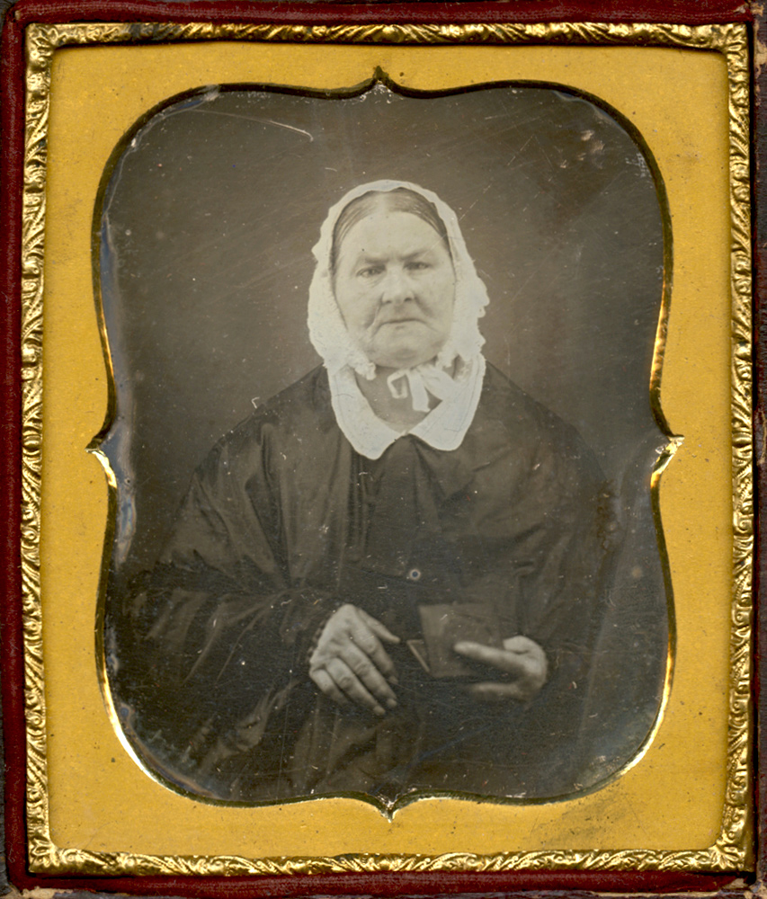 Anonymous - Old Woman Wearing a Bonnet, Holding a Daguerreotype